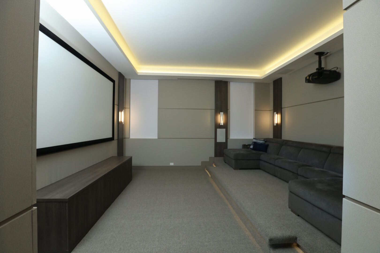 A media room with a large couch