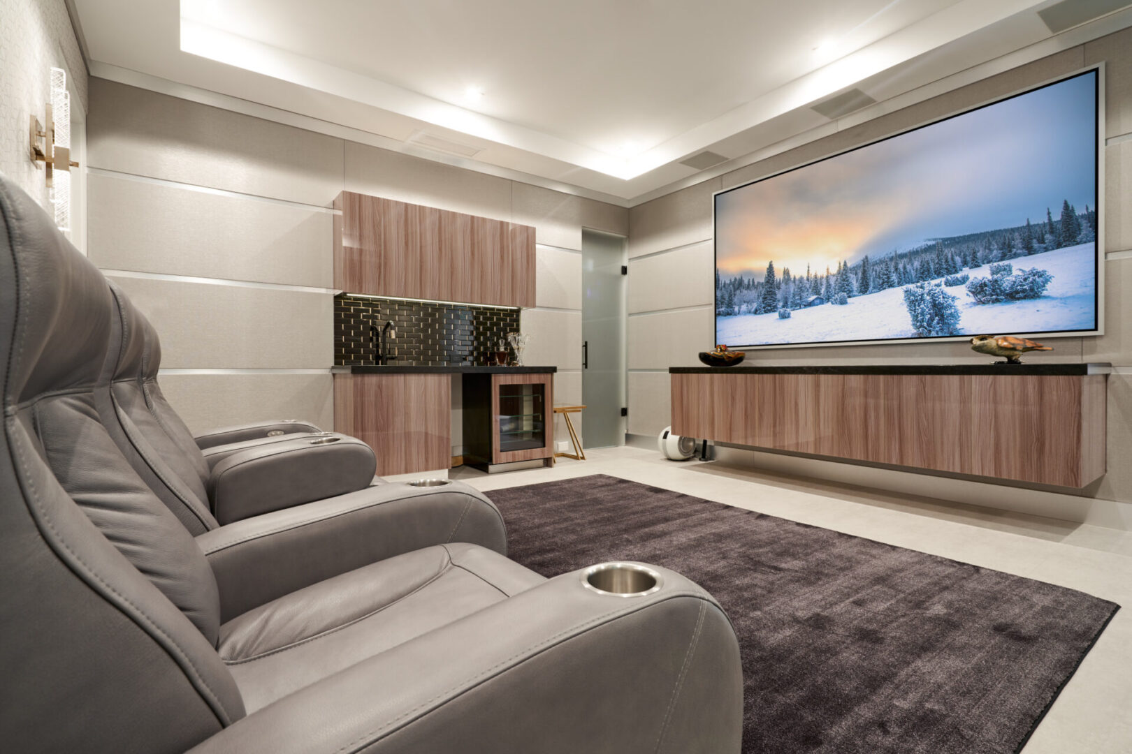 A media room with a huge TV